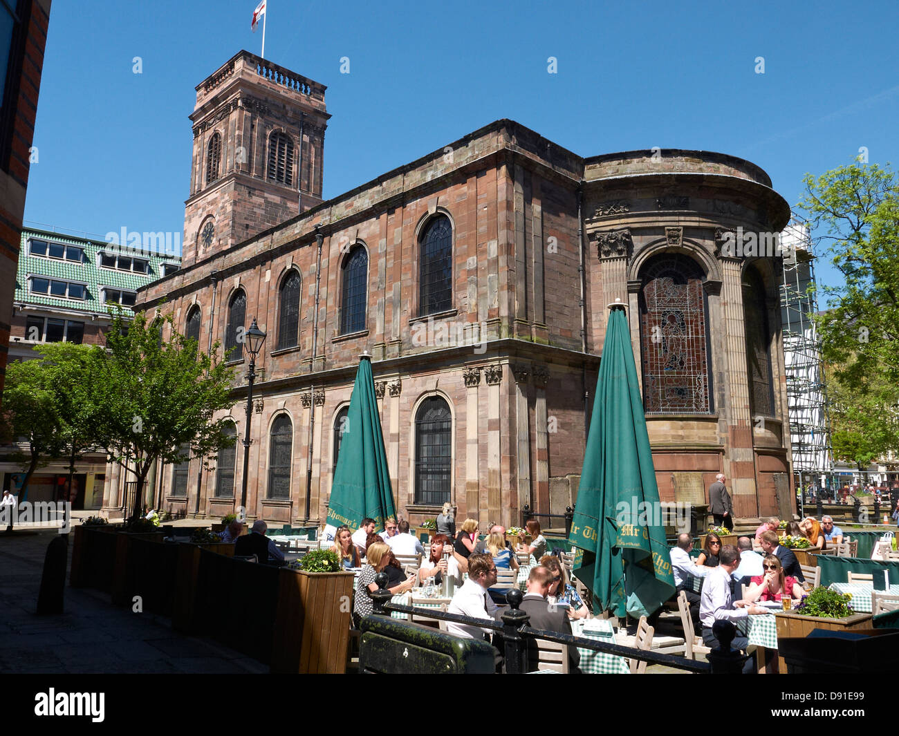 St Ann`s Church with Mr Thomas`s Chop house pavement cafe in Manchester UK Stock Photo